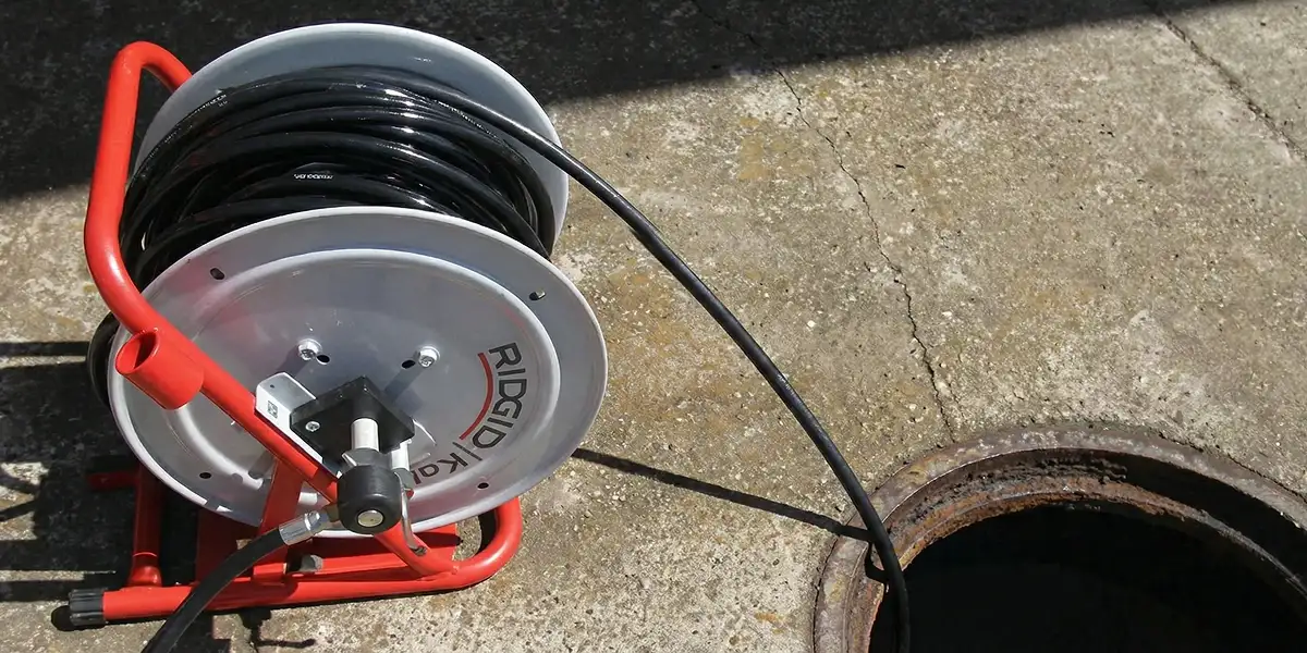 sewer rodding equipment prepared to clear clogged sewer lines in Albany, NY