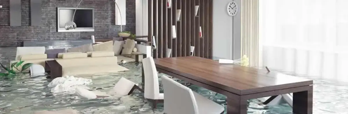 home interior affected by water damage with flooded floors and displaced furniture in Albany, NY
